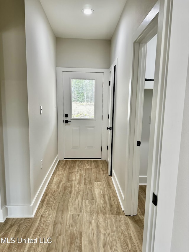 entryway with light hardwood / wood-style floors