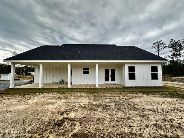 rear view of property featuring french doors