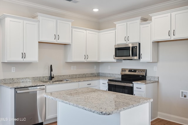 kitchen featuring a sink, white cabinetry, and stainless steel appliances