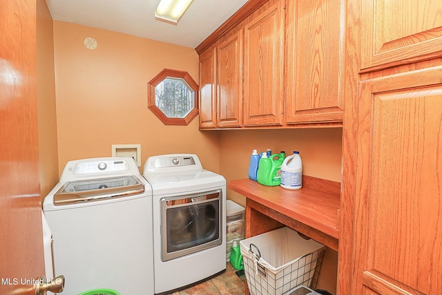 laundry room featuring cabinet space and separate washer and dryer