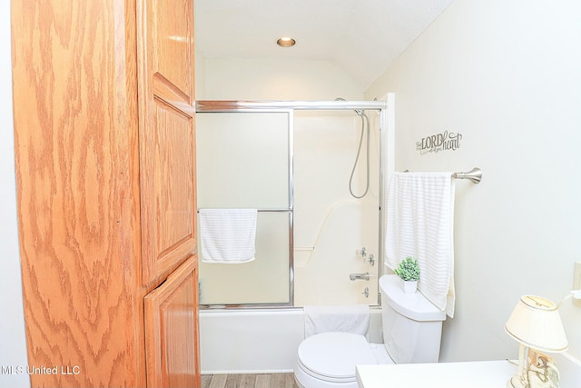 full bath featuring toilet, enclosed tub / shower combo, and lofted ceiling