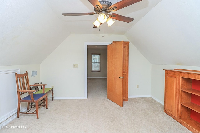 bonus room featuring visible vents, baseboards, a ceiling fan, light colored carpet, and lofted ceiling