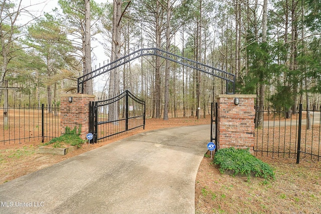 view of gate featuring fence