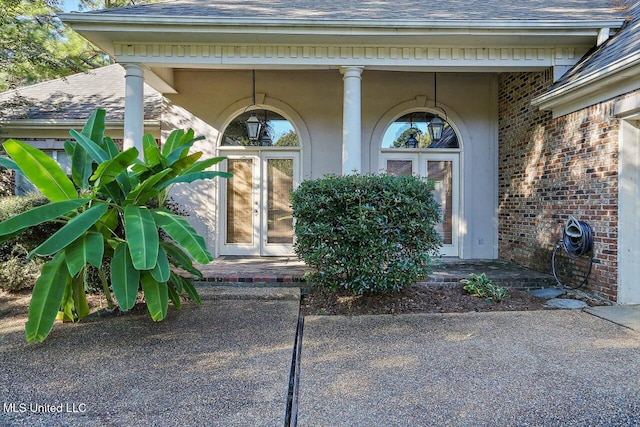 view of exterior entry featuring french doors