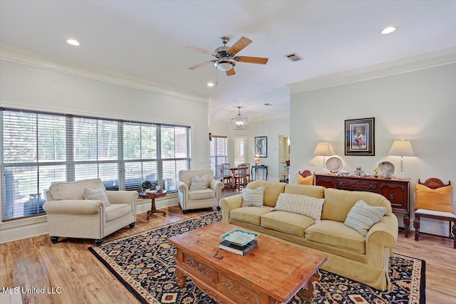 105 Speers Valley Rd, Brandon, MS 39042 - living room with ornamental molding, a ceiling fan, light wood-type flooring, recessed lighting, and a chandelier