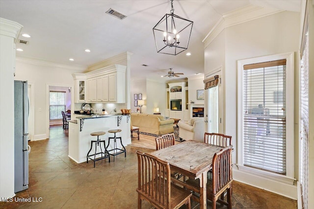 105 Speers Valley Rd, Brandon, MS 39042 - dining area with ornamental molding, recessed lighting, tile patterned floors, baseboards, and a chandelier