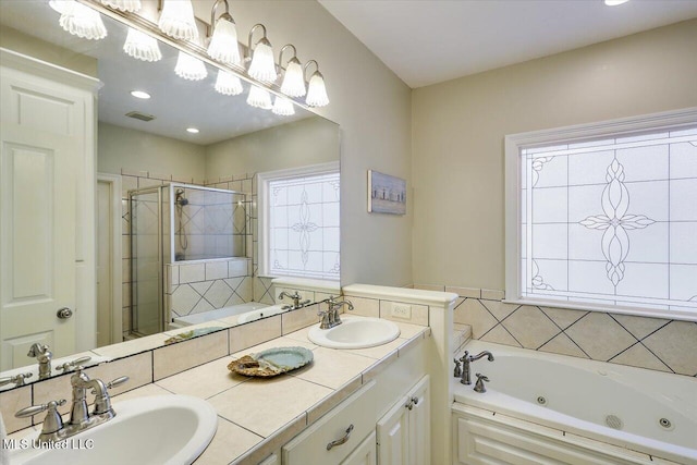 105 Speers Valley Rd, Brandon, MS 39042 - bathroom featuring a stall shower, a jetted tub, and double vanity