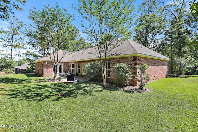 105 Speers Valley Rd, Brandon, MS 39042 - back of house featuring a yard, a patio area, and brick siding