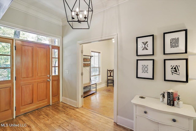 105 Speers Valley Rd, Brandon, MS 39042 - foyer entrance featuring ornamental molding, a chandelier, baseboards, plenty of natural light, and light wood finished floors
