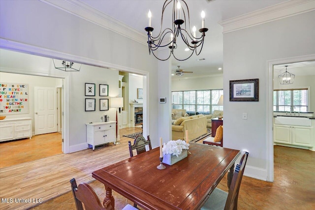 105 Speers Valley Rd, Brandon, MS 39042 - dining room featuring a chandelier, ornamental molding, a fireplace, and baseboards