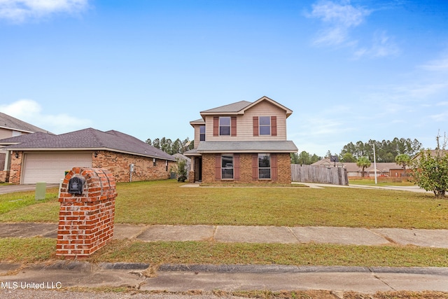 view of front of house featuring a garage and a front yard