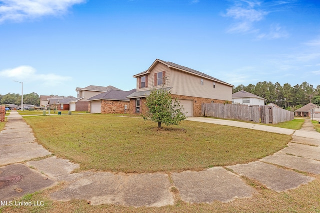 view of front facade with a garage and a front yard