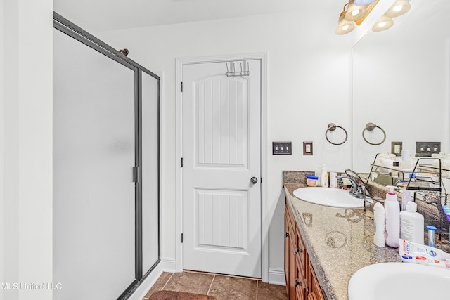 bathroom featuring vanity, tile patterned floors, and a shower with door