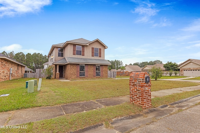 view of front of home with a garage and a front lawn