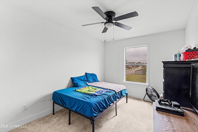 bedroom featuring ceiling fan and carpet floors