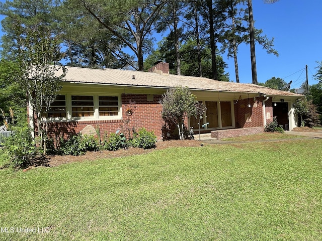 2136 Attala Rd Unit 5247, Kosciusko, MS 39090 - view of front of home featuring a front lawn, a chimney, and brick siding