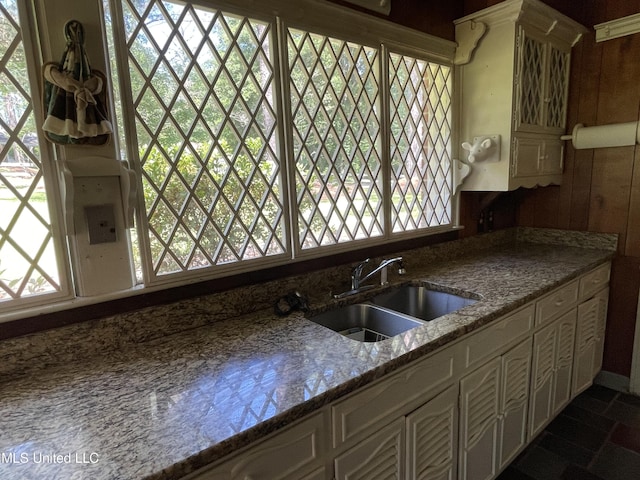 2136 Attala Rd Unit 5247, Kosciusko, MS 39090 - kitchen with stone counters, white cabinetry, a wealth of natural light, and a sink