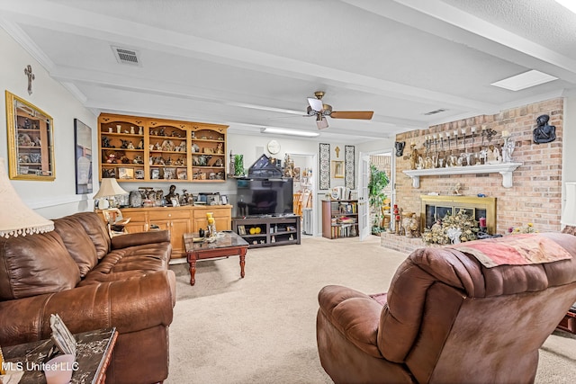 living room with beamed ceiling, ceiling fan, carpet floors, and a fireplace