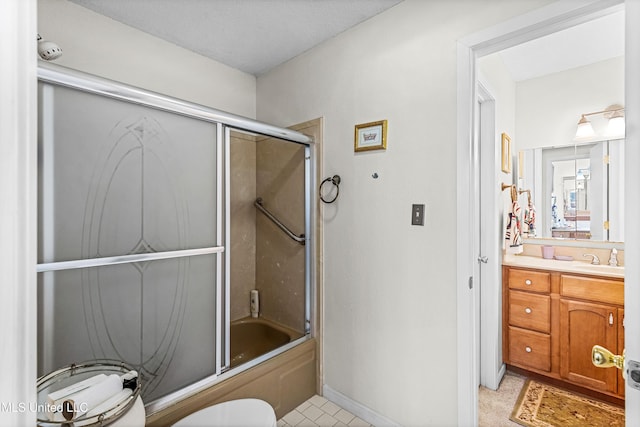 full bathroom with vanity, toilet, enclosed tub / shower combo, and a textured ceiling