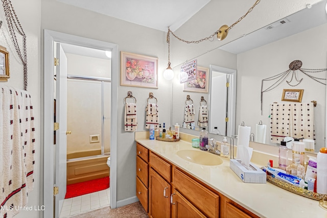 bathroom featuring vanity, tile patterned floors, and  shower combination