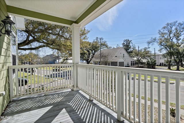 balcony with a residential view and covered porch