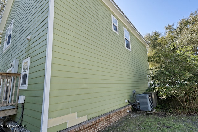 view of side of property with cooling unit