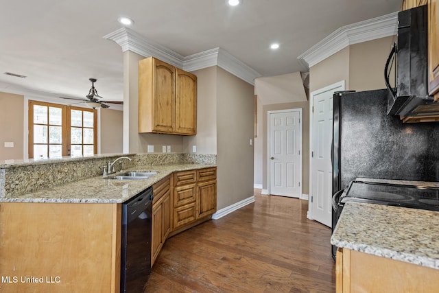 kitchen featuring ornamental molding, visible vents, a sink, and black appliances