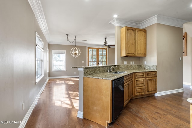 kitchen featuring black dishwasher, dark wood-type flooring, ornamental molding, a sink, and light stone countertops