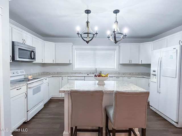 kitchen featuring a kitchen island, white cabinetry, dark wood-type flooring, pendant lighting, and white appliances