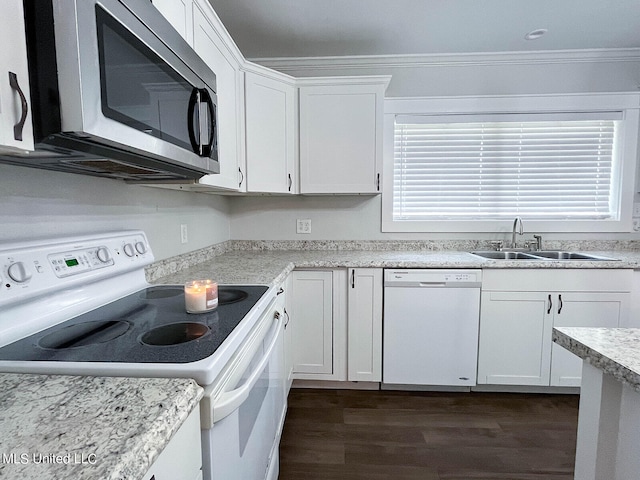 kitchen with white appliances, sink, white cabinetry, dark wood-type flooring, and ornamental molding