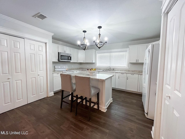 106 Piney Ridge Rd, Waveland, MS 39576 - kitchen with a notable chandelier, a sink, white appliances, visible vents, and ornamental molding