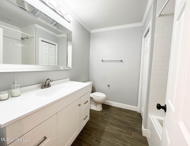 full bathroom featuring shower / bathing tub combination, toilet, vanity, hardwood / wood-style flooring, and ornamental molding