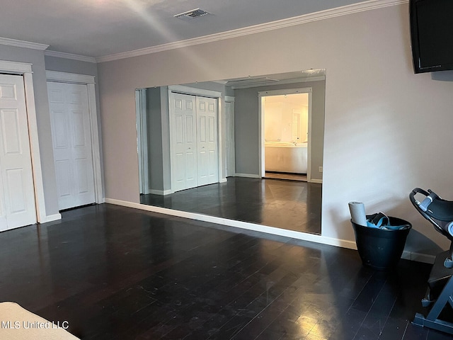 bedroom with crown molding and dark hardwood / wood-style floors