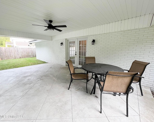 106 Piney Ridge Rd, Waveland, MS 39576 - view of patio / terrace featuring ceiling fan, fence, french doors, and outdoor dining space