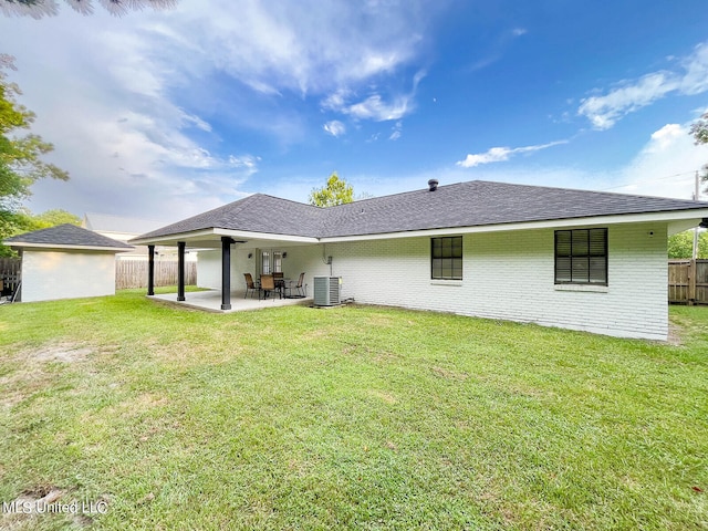 back of house featuring a yard, a patio, and cooling unit