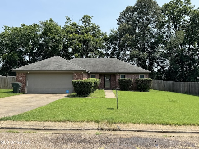 127 Nichols Blvd, Senatobia, MS 38668 - ranch-style home featuring an attached garage, brick siding, concrete driveway, and a shingled roof