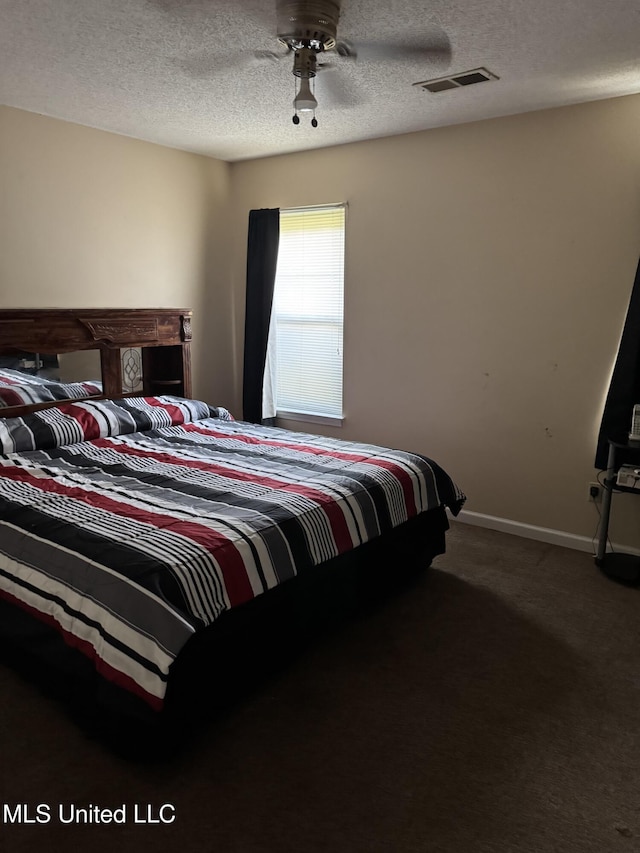 127 Nichols Blvd, Senatobia, MS 38668 - bedroom featuring carpet, a textured ceiling, and a ceiling fan