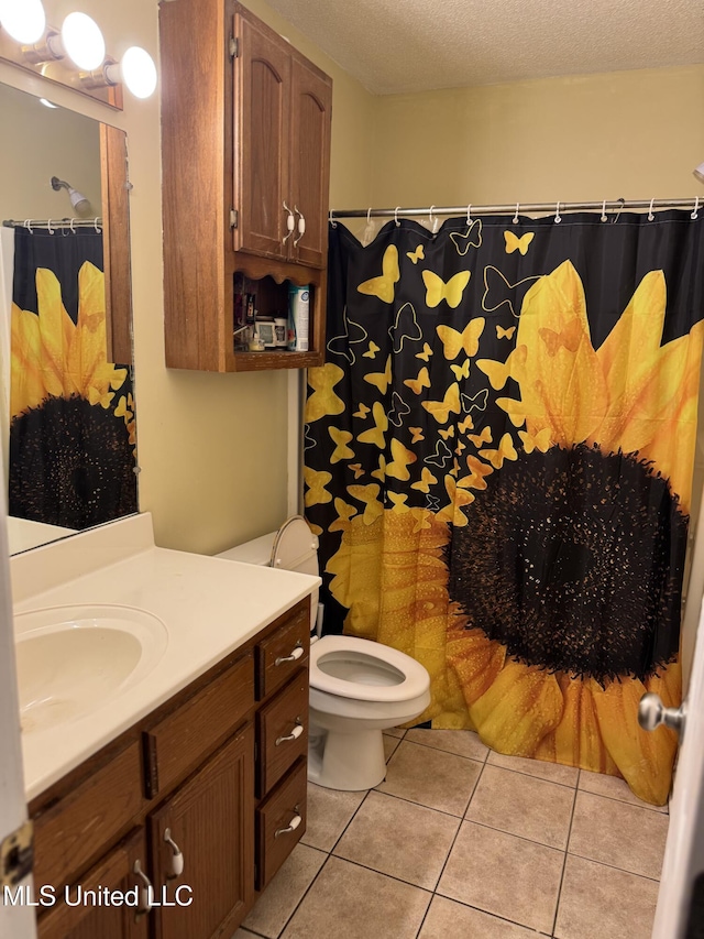127 Nichols Blvd, Senatobia, MS 38668 - bathroom with vanity, tile patterned flooring, a textured ceiling, and a shower with curtain