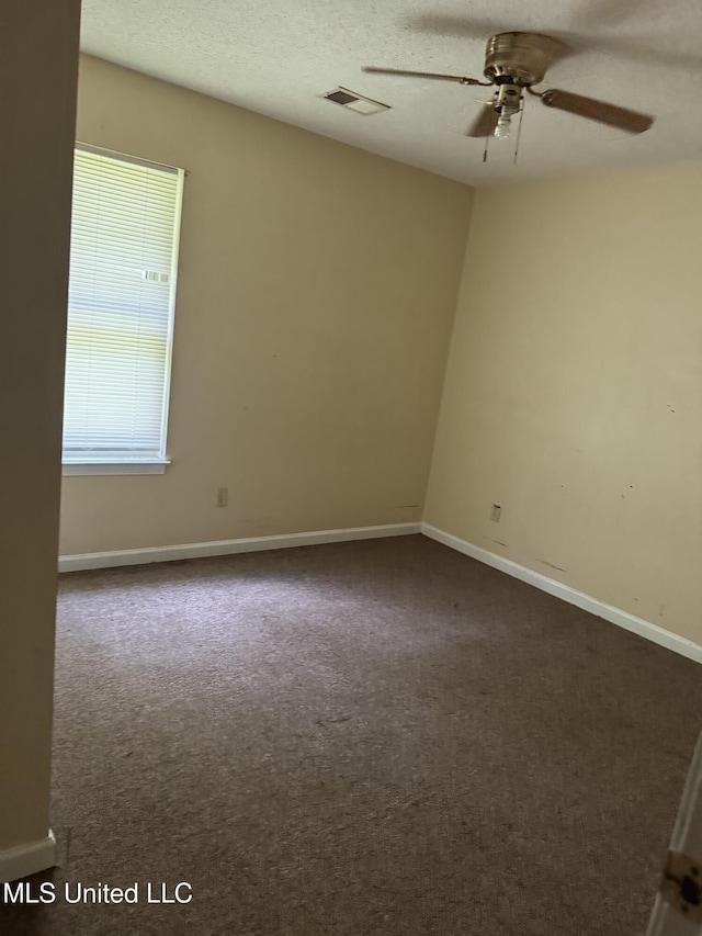127 Nichols Blvd, Senatobia, MS 38668 - empty room with a ceiling fan and dark colored carpet