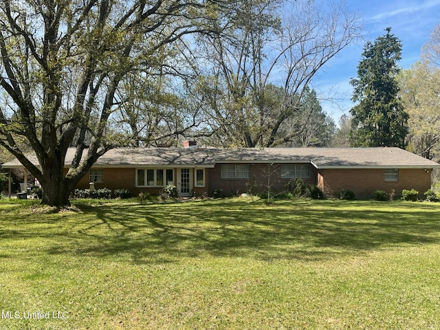 ranch-style home featuring a front yard