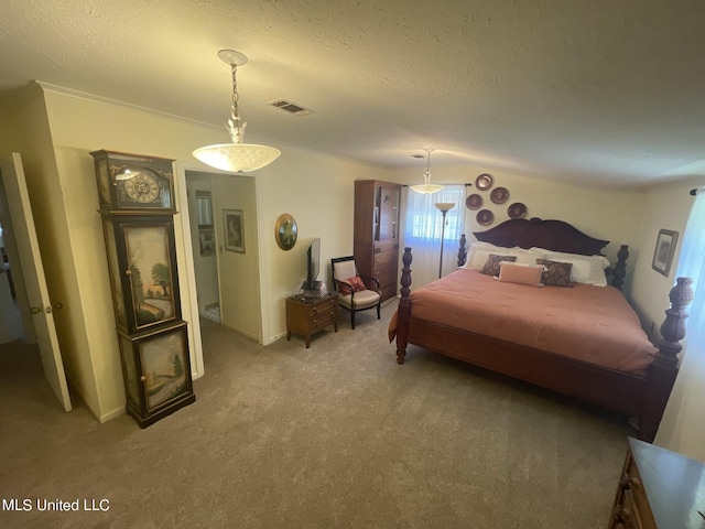 13137 Old Port Gibson Rd, Utica, MS 39175 - bedroom with visible vents, a textured ceiling, and light colored carpet