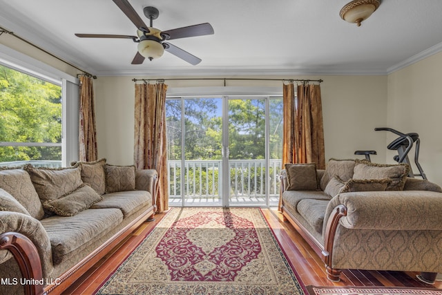 420 N Caribe Pl, Gulfport, MS 39507 - living room featuring wood finished floors, plenty of natural light, crown molding, and ceiling fan
