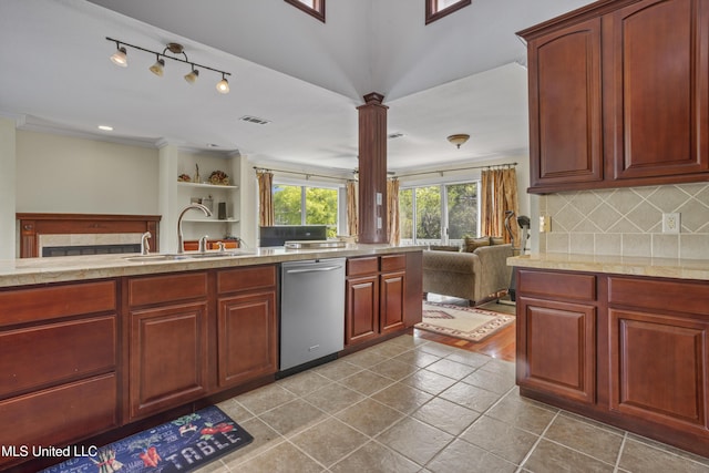 420 N Caribe Pl, Gulfport, MS 39507 - kitchen featuring dishwasher, open floor plan, a sink, backsplash, and ornate columns