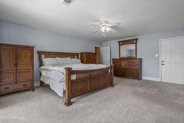 420 N Caribe Pl, Gulfport, MS 39507 - bedroom with light carpet, baseboards, and a ceiling fan