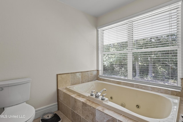 420 N Caribe Pl, Gulfport, MS 39507 - full bathroom with a whirlpool tub, plenty of natural light, and toilet