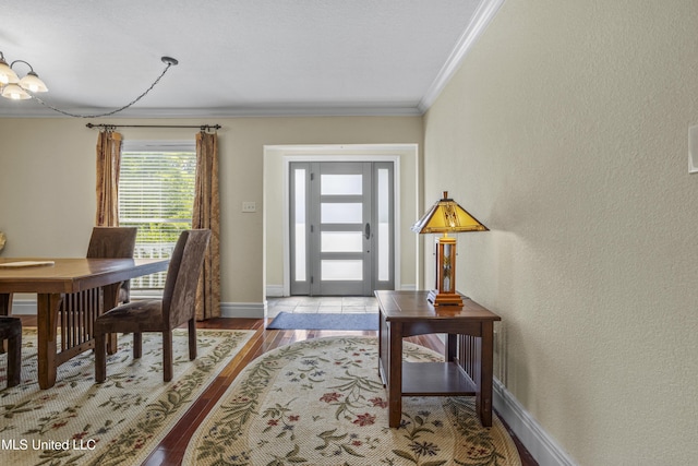 420 N Caribe Pl, Gulfport, MS 39507 - foyer entrance with ornamental molding, baseboards, wood finished floors, and a textured wall