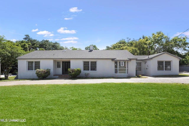 ranch-style house with a front yard