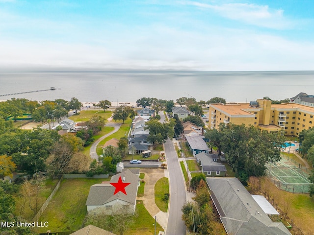 birds eye view of property with a water view