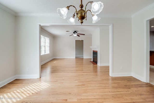 unfurnished living room featuring crown molding, ceiling fan with notable chandelier, a textured ceiling, and light wood-type flooring