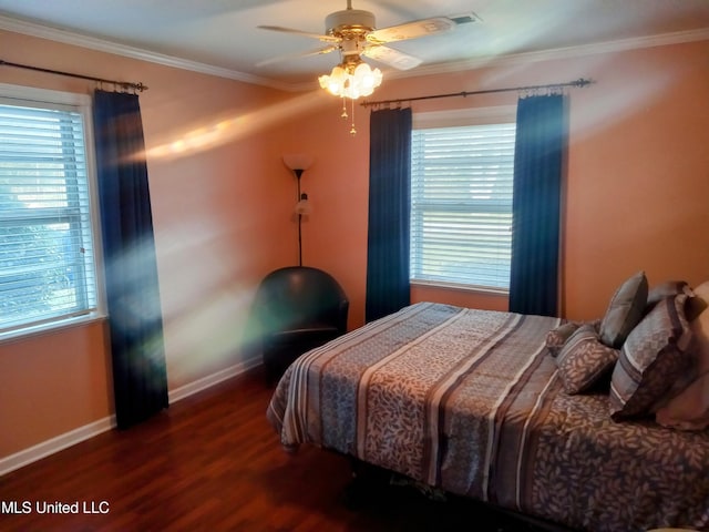 701 W Gresham St, Indianola, MS 38751 - bedroom featuring dark hardwood / wood-style flooring, multiple windows, ceiling fan, and crown molding